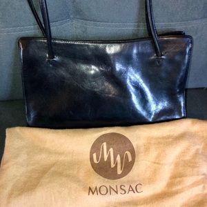 Black leather Monsac shoulder bag with dust bag